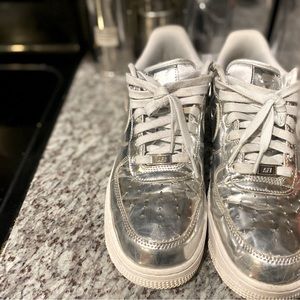 A pair of platinum Air Force size 10